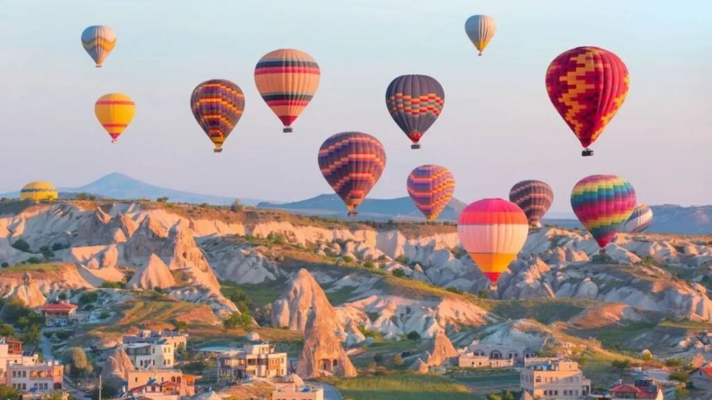 Cappadocia hot air balloons over fairy chimneys at sunrise